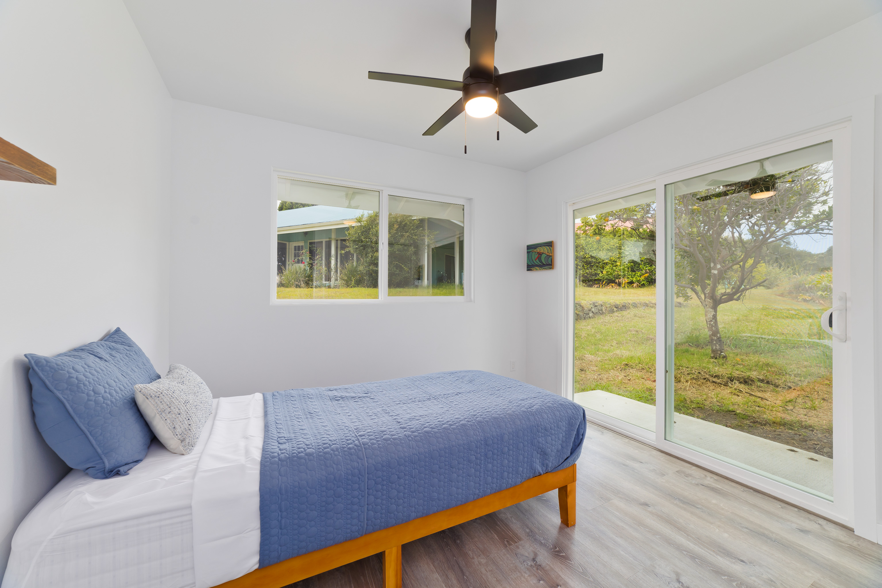 99-2016 Pukeawe Circle Volcano, HI 96785 - Photo 17 of 28 a bedroom with a large bed and a window