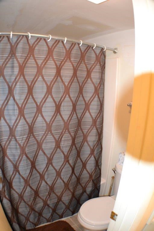 1372 Hunters Road, Unit B Harrisonburg, VA 22801 - Photo 15 of 22 a white toilet sitting next to a white wall