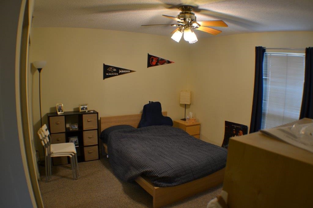 1372 Hunters Road, Unit B Harrisonburg, VA 22801 - Photo 16 of 22 a living room with furniture and a chandelier
