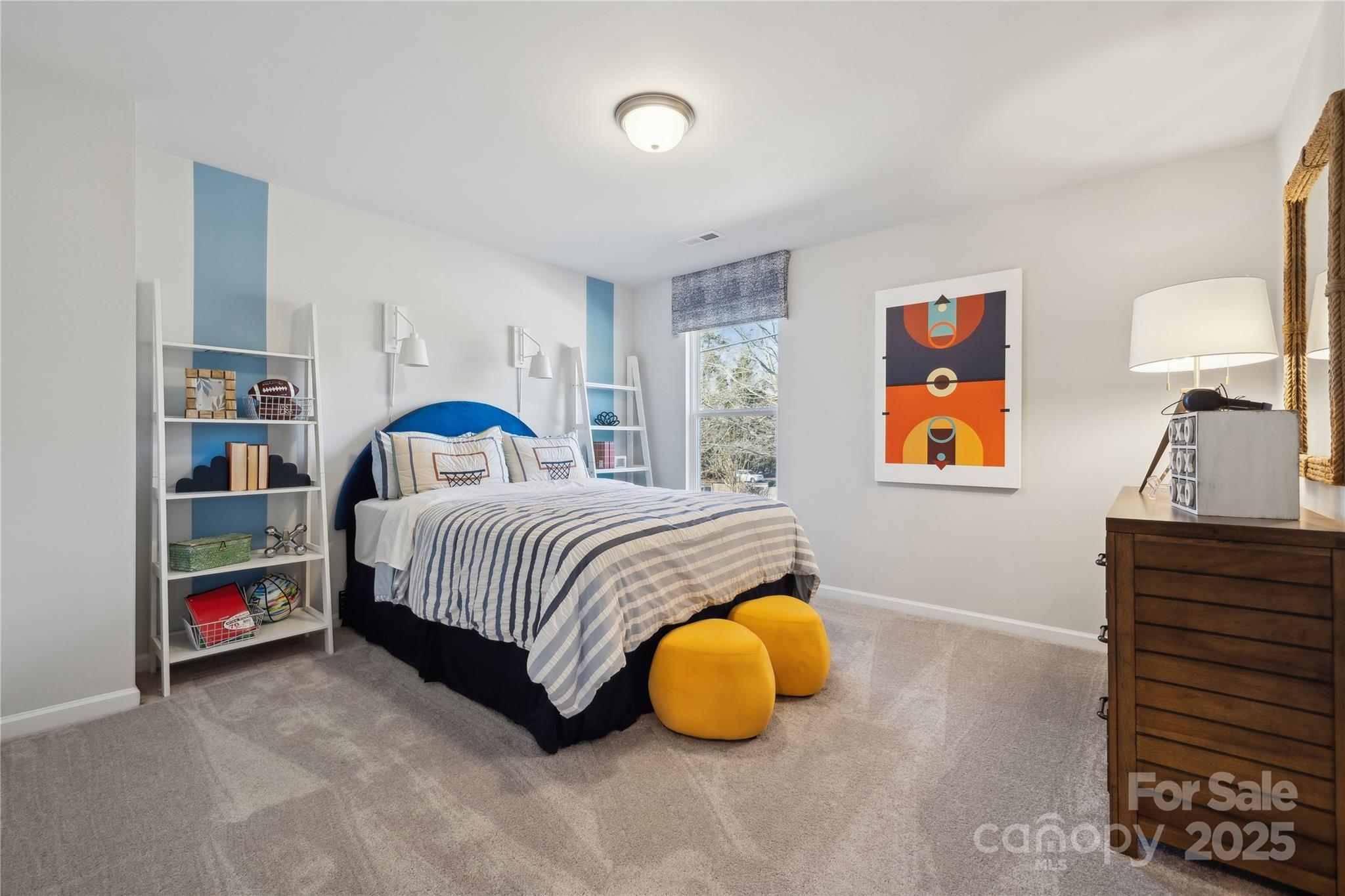 6514 Alanbrook Road Charlotte, NC 28215 - Photo 27 of 36 a bedroom with a bed and painting on the wall