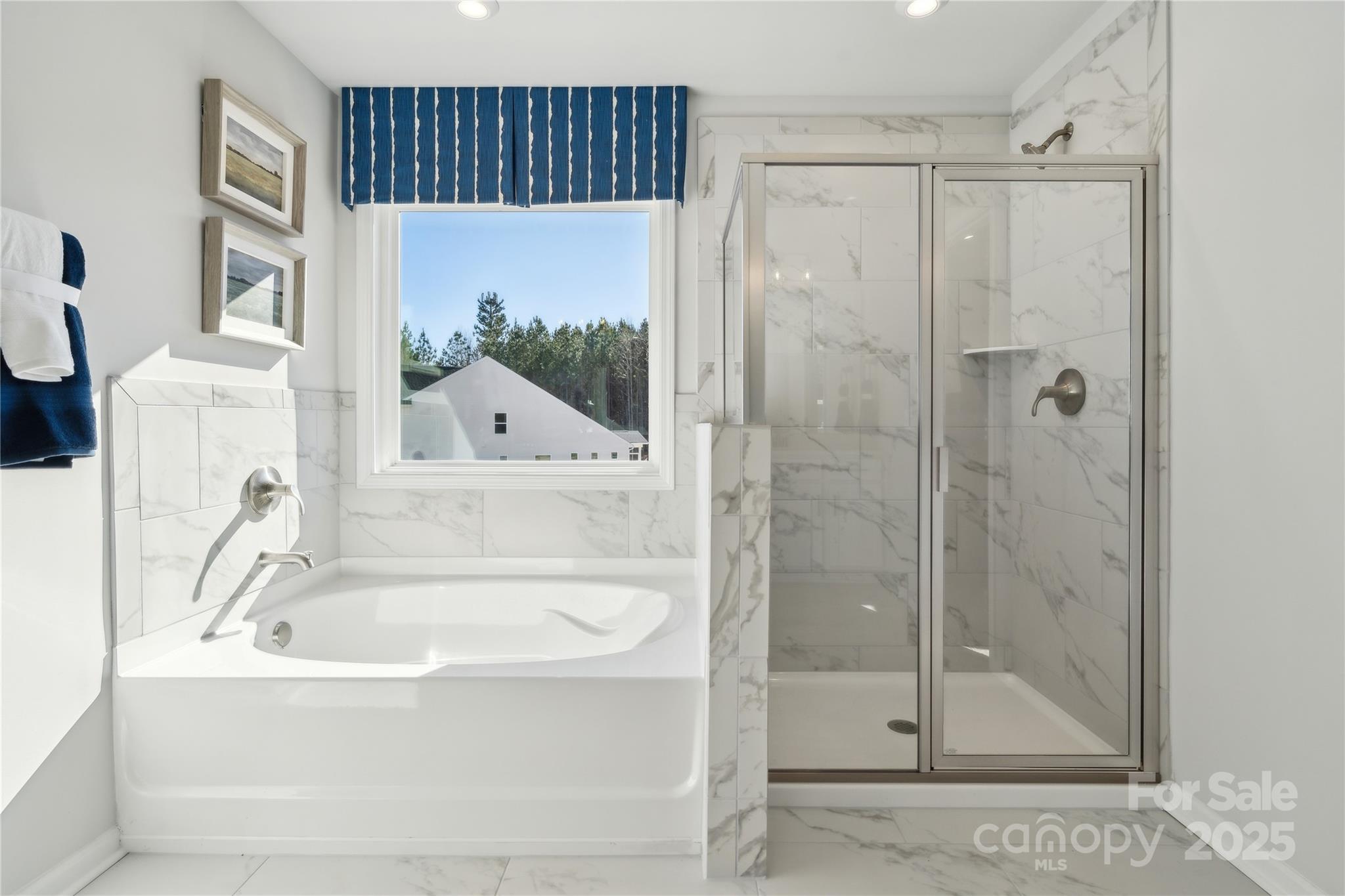 6514 Alanbrook Road Charlotte, NC 28215 - Photo 31 of 36 a bathroom with a bathtub and a shower