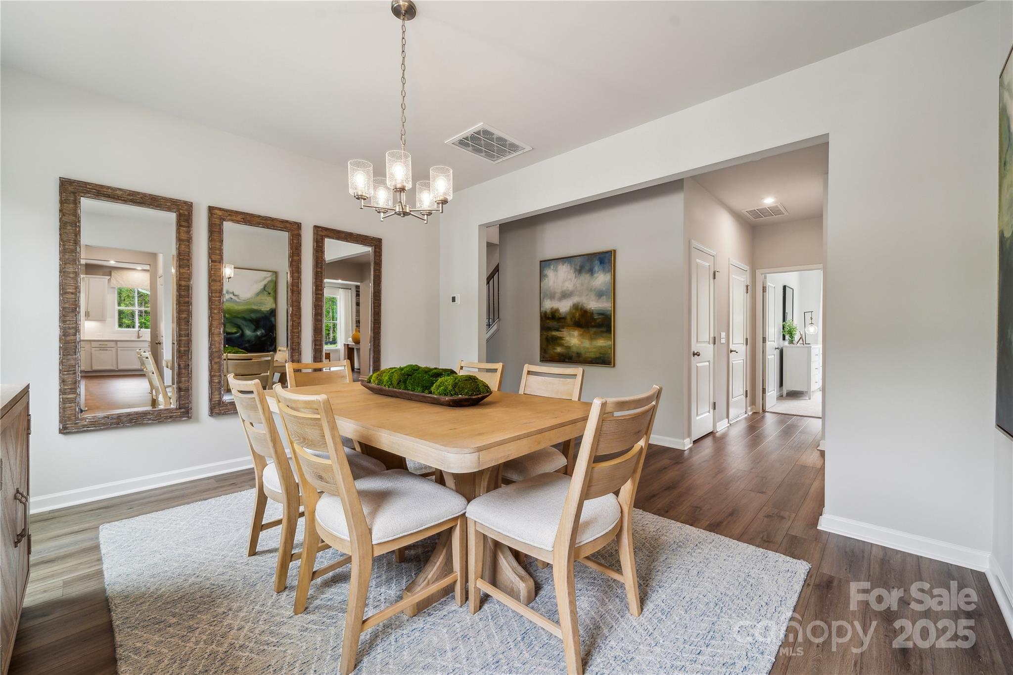 6514 Alanbrook Road Charlotte, NC 28215 - Photo 8 of 36 a view of a dining room with furniture and wooden floor