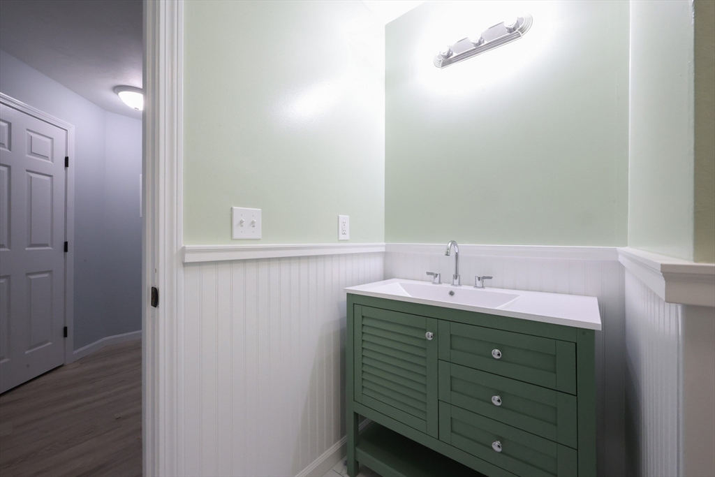 10 Nuttall Lane, Unit 1 Worcester, MA 01604 - Photo 11 of 28 a bathroom with a sink and a mirror