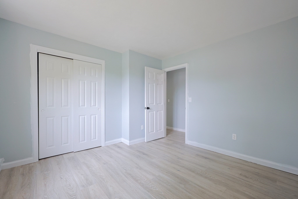 10 Nuttall Lane, Unit 1 Worcester, MA 01604 - Photo 17 of 28 a view of an empty room and wooden floor