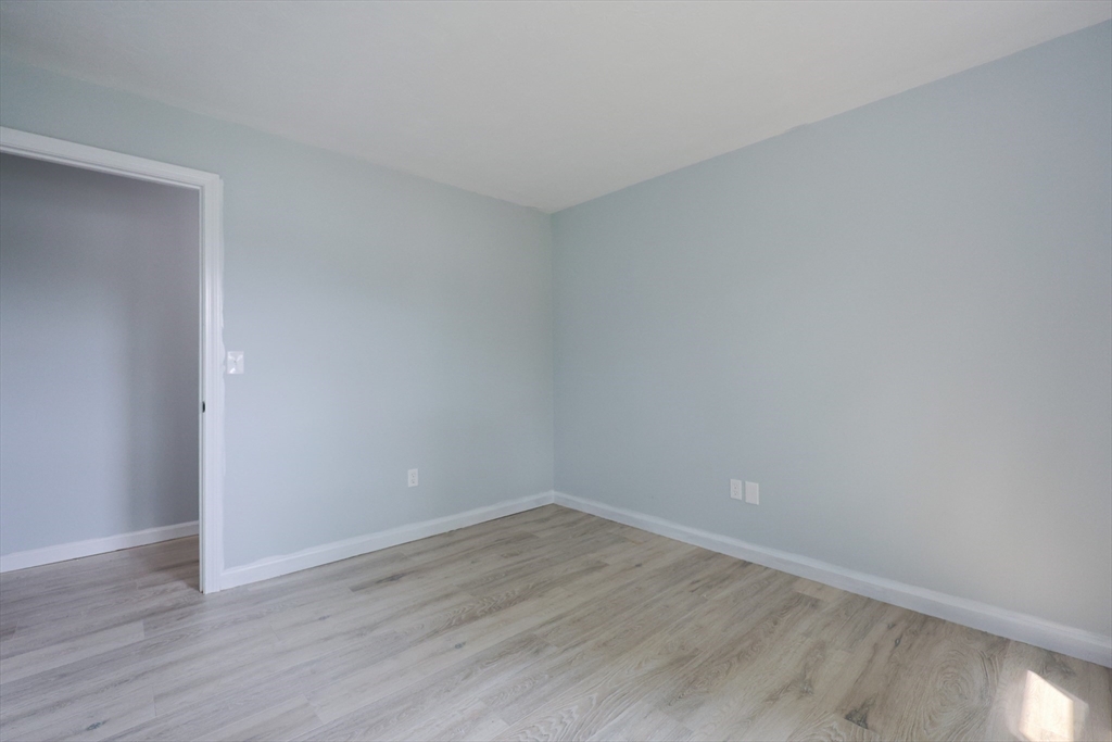10 Nuttall Lane, Unit 1 Worcester, MA 01604 - Photo 18 of 28 a view of an empty room with wooden floor