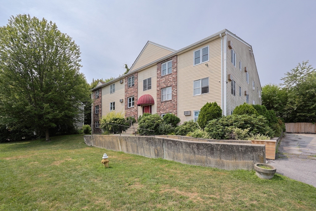 10 Nuttall Lane, Unit 1 Worcester, MA 01604 - Photo 23 of 28 a front view of a house with a yard