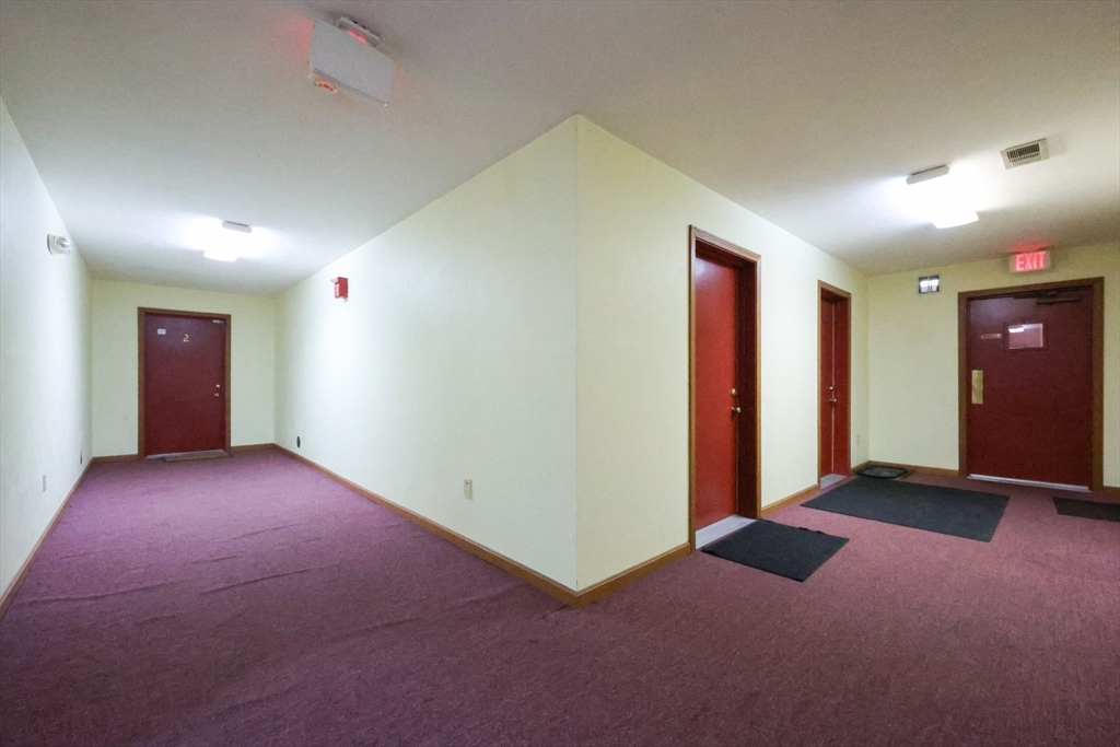10 Nuttall Lane, Unit 1 Worcester, MA 01604 - Photo 26 of 28 an empty room with closet and windows