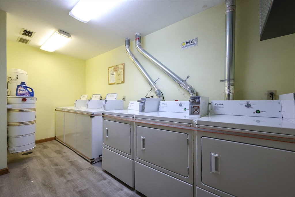 10 Nuttall Lane, Unit 1 Worcester, MA 01604 - Photo 27 of 28 a utility room with a sink dryer and washer