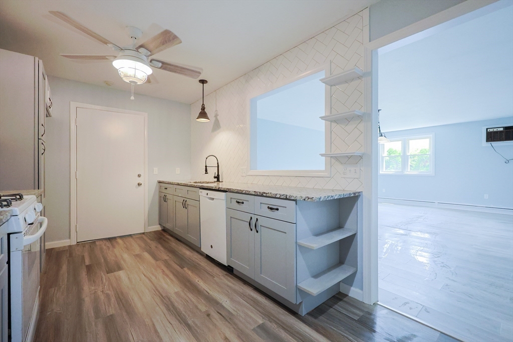 10 Nuttall Lane, Unit 1 Worcester, MA 01604 - Photo 3 of 28 a kitchen with white cabinets and sink