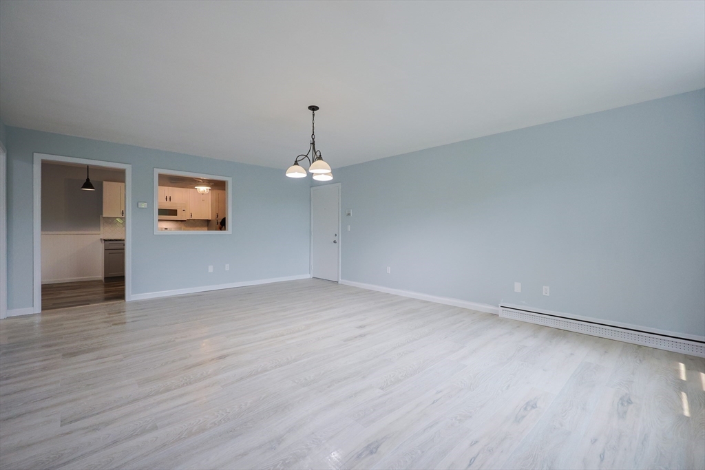 10 Nuttall Lane, Unit 1 Worcester, MA 01604 - Photo 8 of 28 a view of empty room with wooden floor