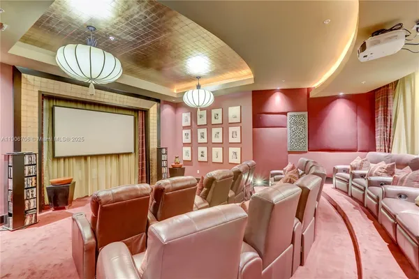 a view of a dining room with furniture and a chandelier