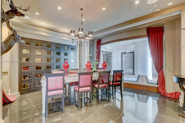 a dining room with granite countertop a table and chairs