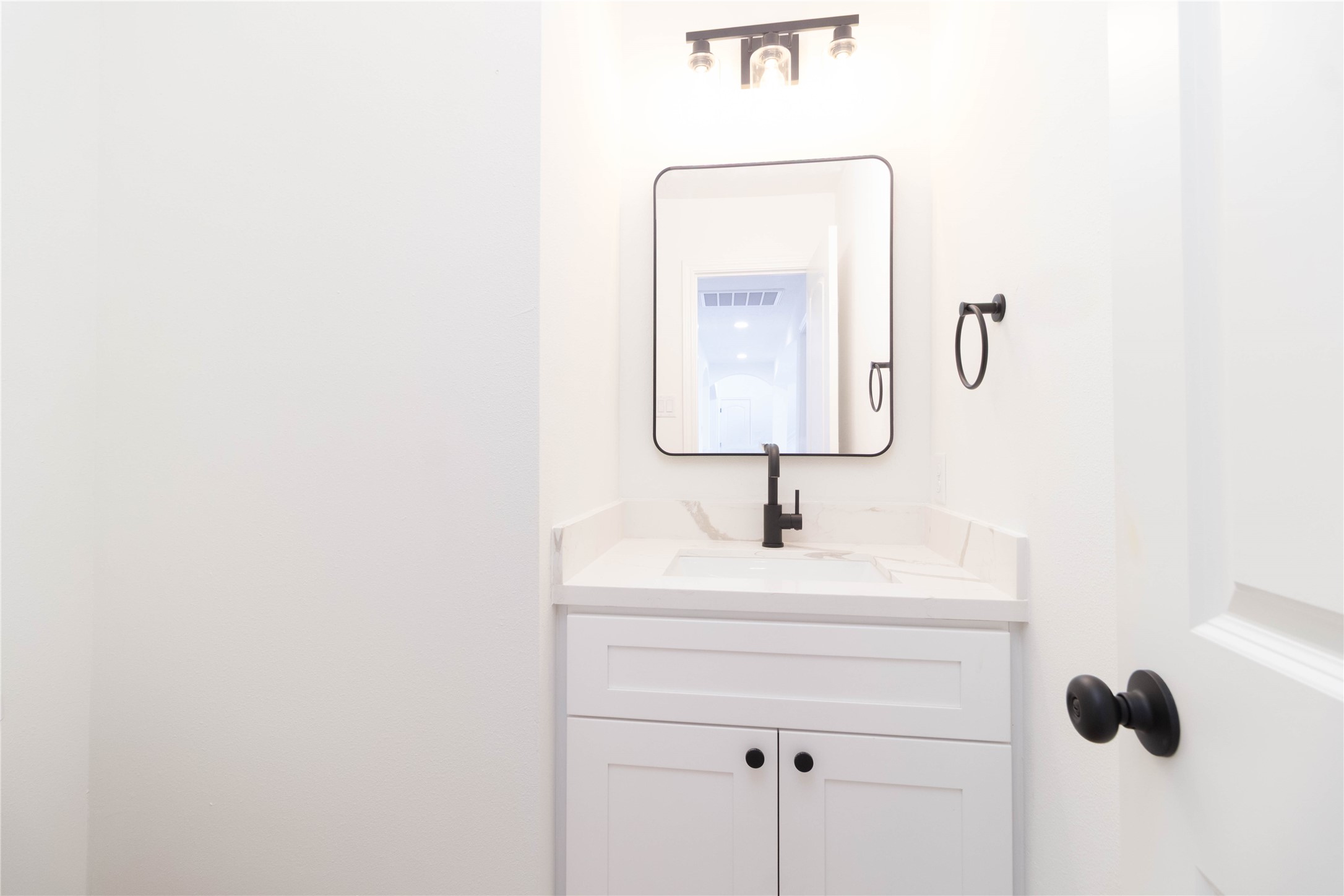 415 Binnacle Way Crosby, TX 77532 - Photo 16 of 50 a bathroom with a sink vanity and a mirror