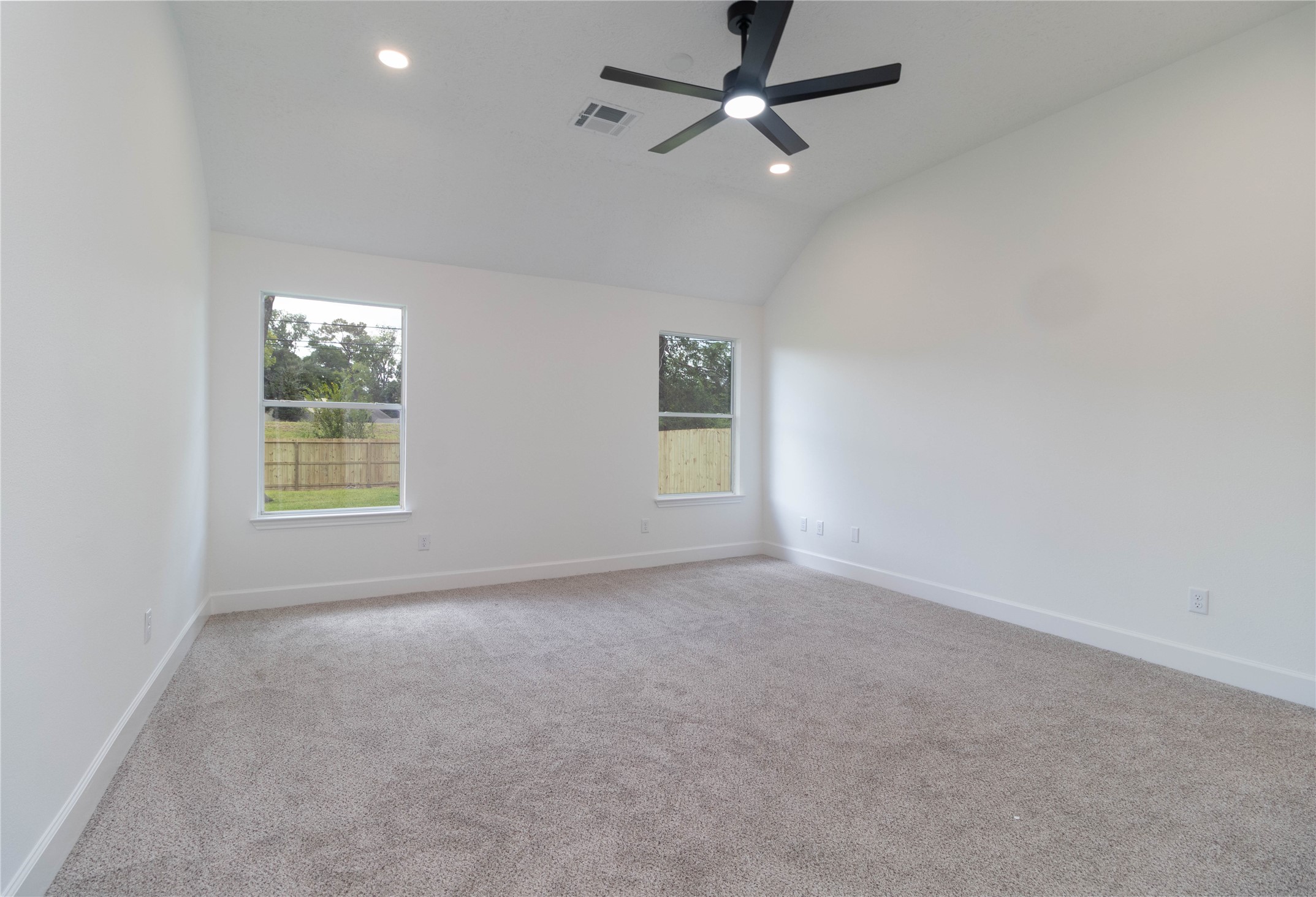 415 Binnacle Way Crosby, TX 77532 - Photo 17 of 50 an empty room with windows and fan