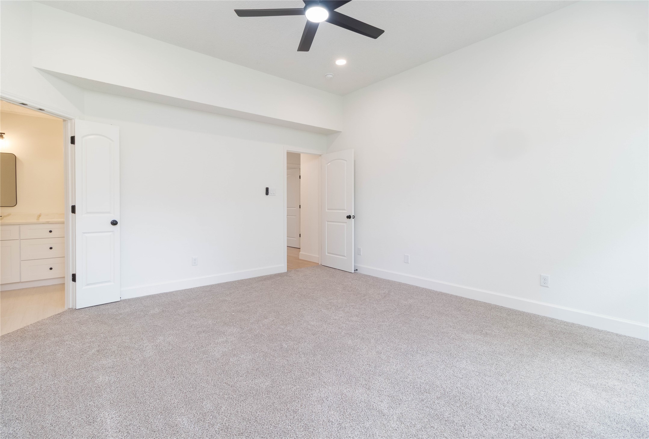 415 Binnacle Way Crosby, TX 77532 - Photo 18 of 50 an empty room with a ceiling fan and carpet
