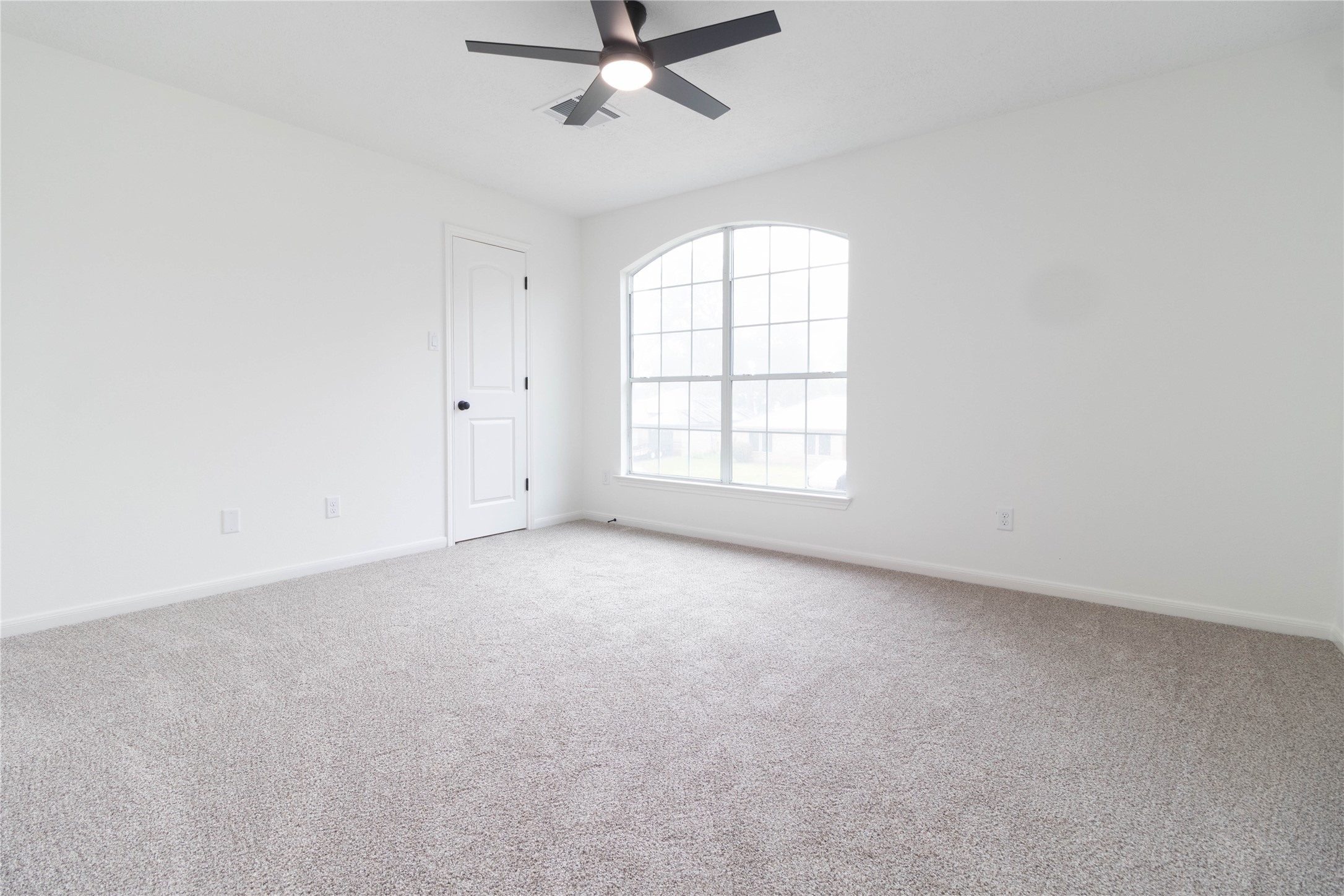 415 Binnacle Way Crosby, TX 77532 - Photo 27 of 50 an empty room with a window and a fan