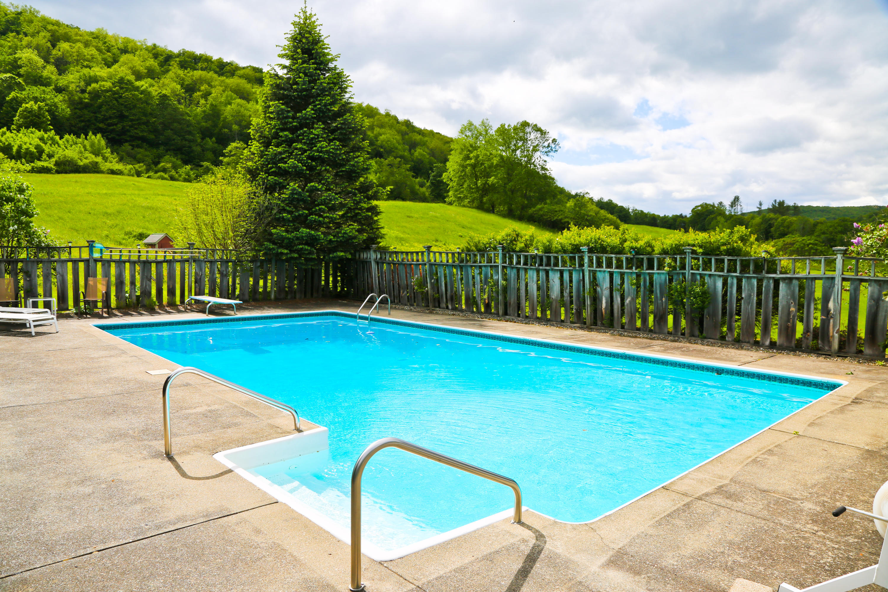 32 White Road Colrain, MA 01340 - Photo 23 of 34 a view of a swimming pool with a patio and a yard