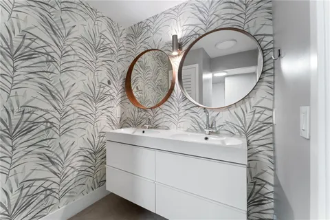 a bathroom with a sink and mirror