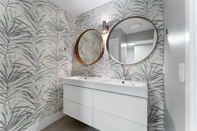 a bathroom with a sink and mirror