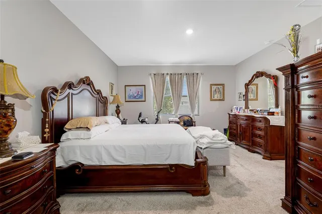 a bedroom with bed and a window