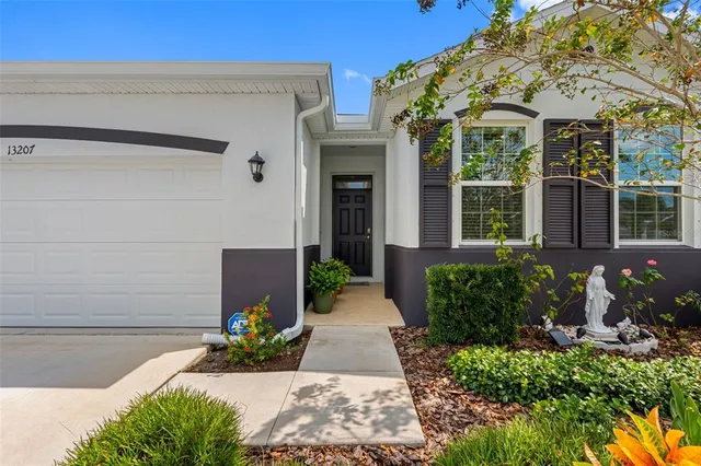 a view of a house with potted plants