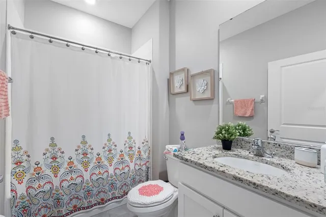 a view of empty room with floor to ceiling windows and floor to ceiling window