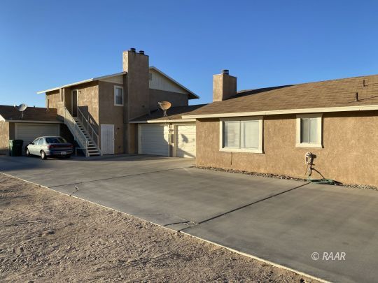 1533 North Erwin Street Ridgecrest, CA 93555 - Photo 5 of 5 a view of a car park in front of house