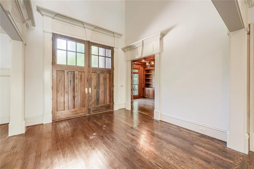 7965 Robin Road Cumming, GA 30041 - Photo 10 of 64 an empty room with wooden floor and windows