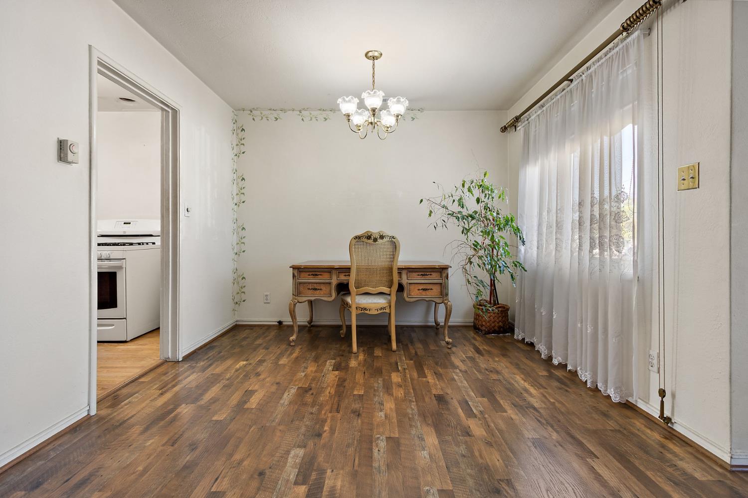 928 Jean Way Hayward, CA 94545 - Photo 11 of 36 a furnished dining room with a window and wooden floor