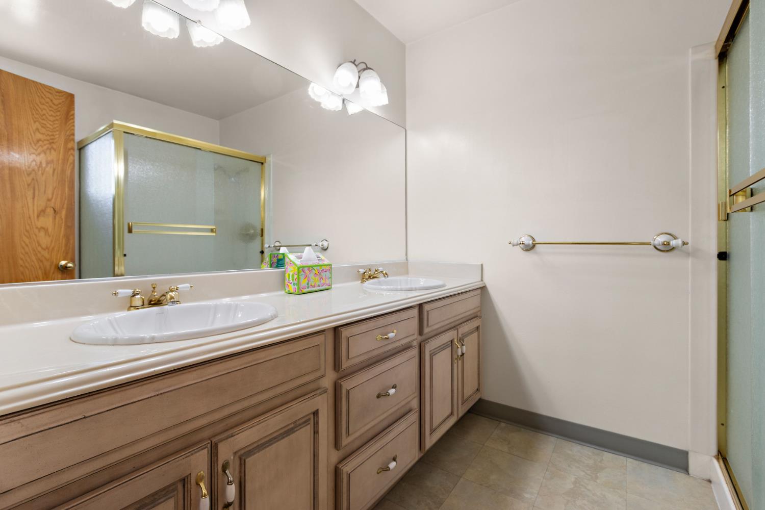 928 Jean Way Hayward, CA 94545 - Photo 24 of 36 a spacious bathroom with a double vanity sink and a mirror