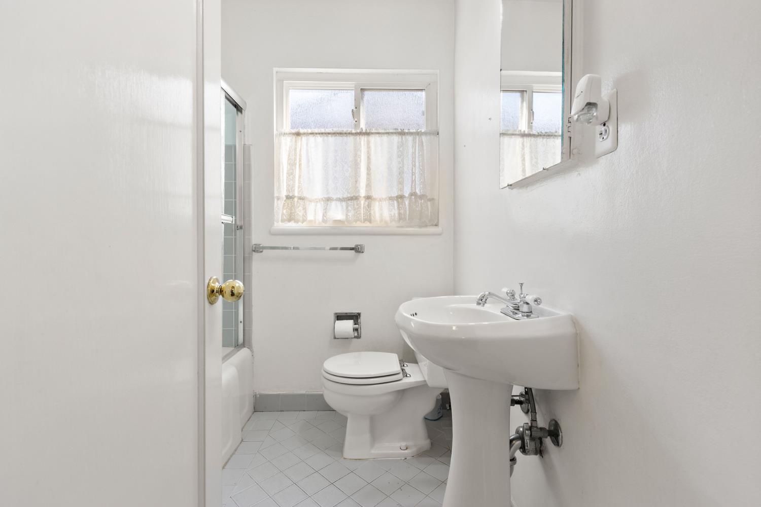 928 Jean Way Hayward, CA 94545 - Photo 27 of 36 a bathroom with a toilet sink and mirror