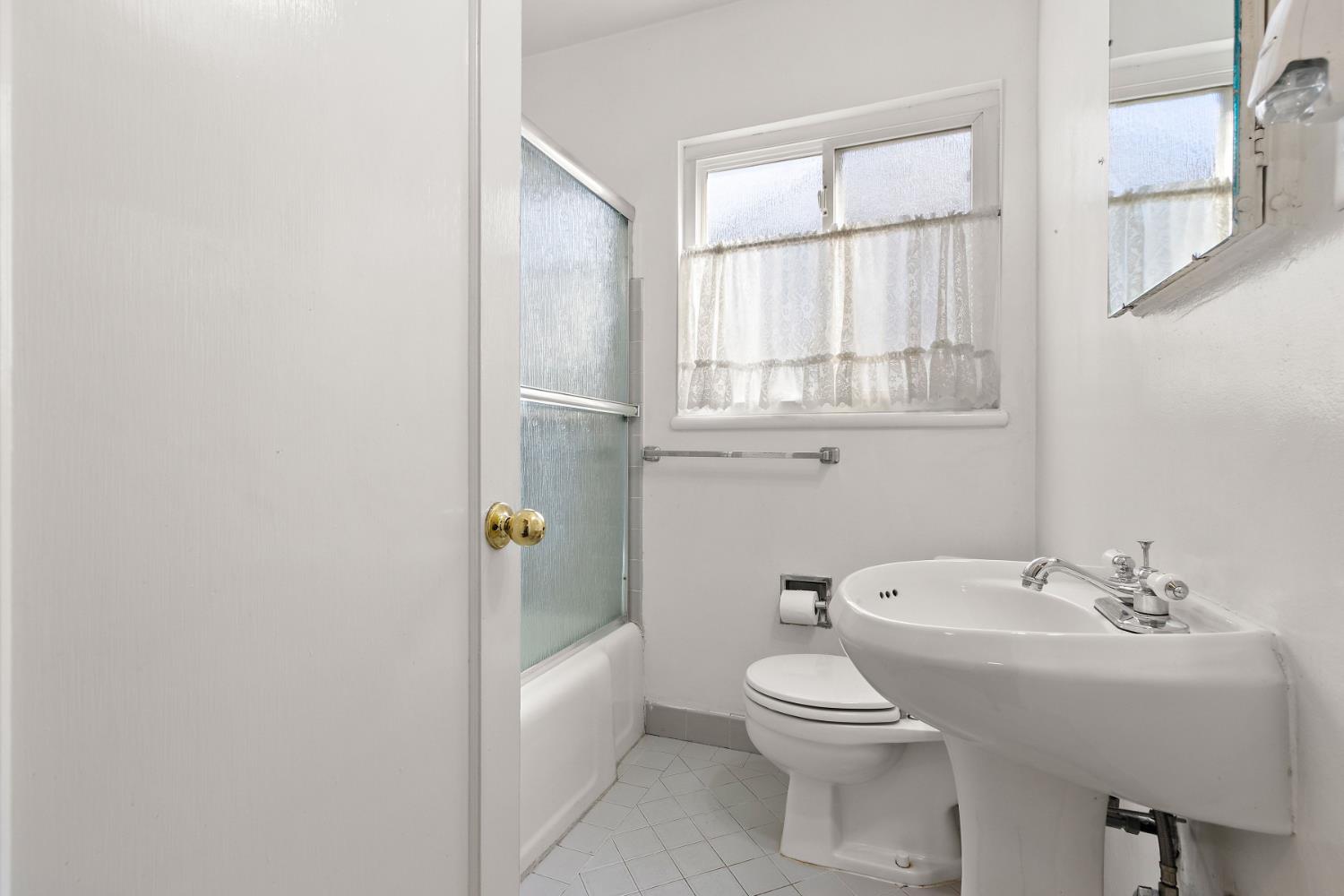 928 Jean Way Hayward, CA 94545 - Photo 28 of 36 a bathroom with a toilet a sink and mirror