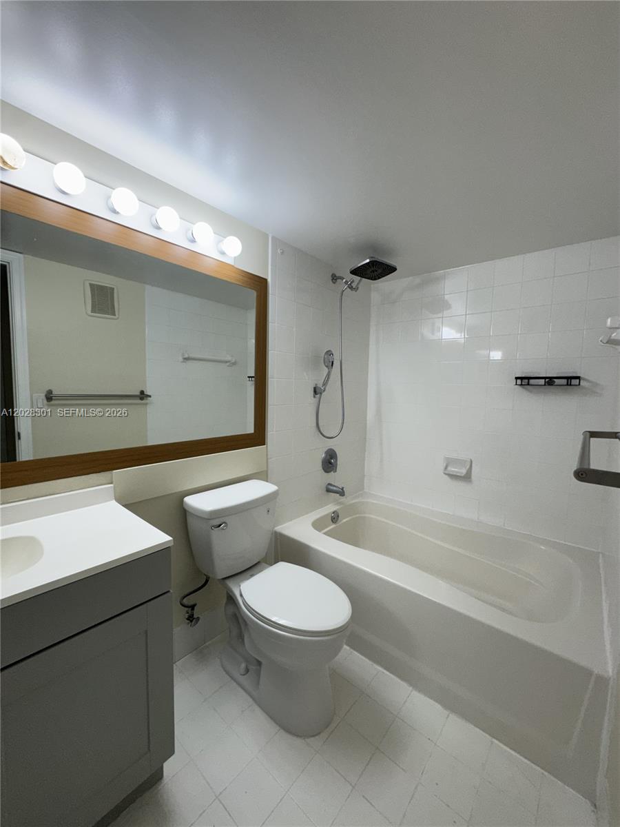 2021 Renaissance Boulevard, Unit 201 Miramar, FL 33025 - Photo 17 of 26 a bathroom with a toilet a sink and bathtub
