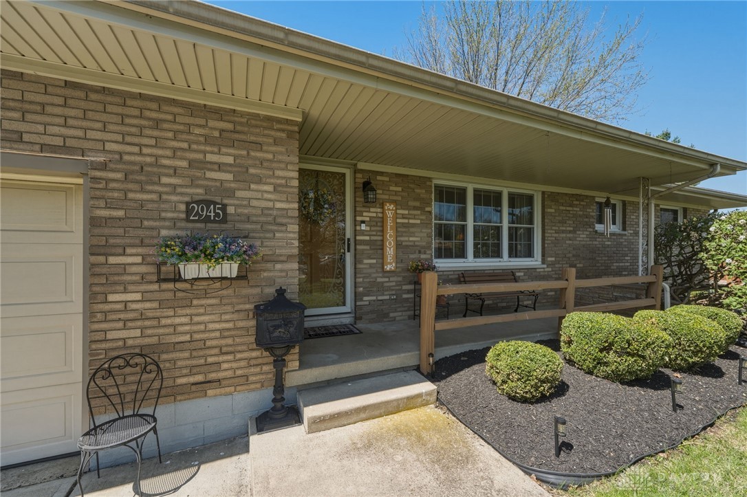 2945 Ashlar Drive Springfield, OH 45503 - Photo 2 of 20 This charming home features a brick facade, welcoming porch, and well-maintained landscaping.