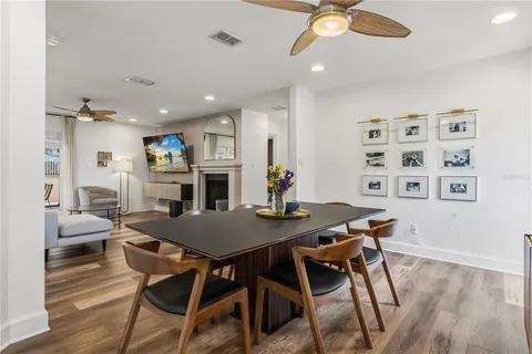 a view of a dining room with furniture and wooden floor