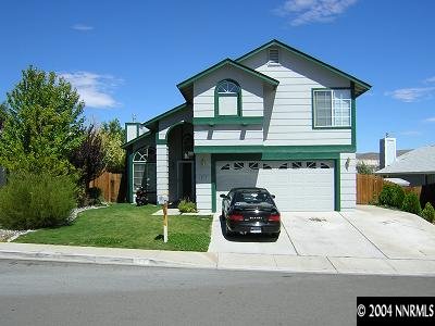 a car parked in front of a house