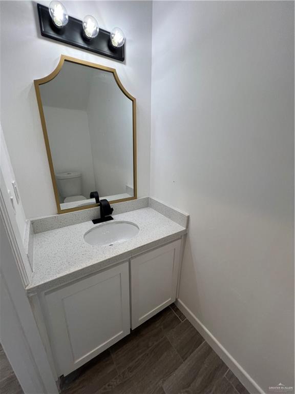 1624 West B Street Mission, TX 78572 - Photo 4 of 10 a bathroom with a sink and mirror