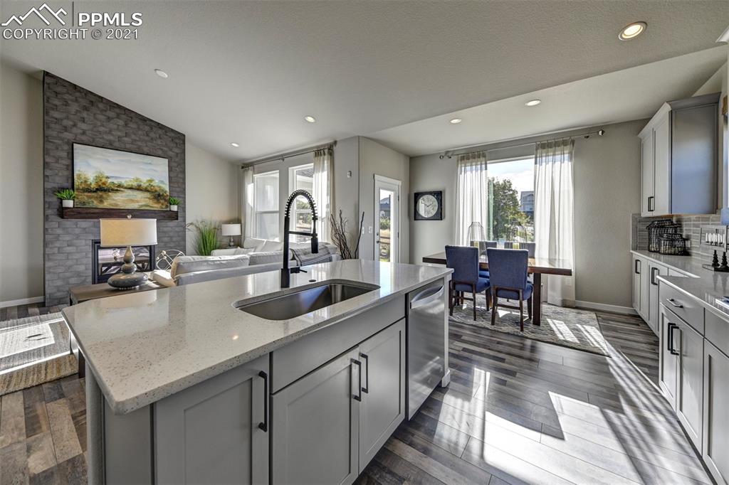 2903 Golden Meadow Way Colorado Springs, CO 80908 - Photo 14 of 49 a kitchen with sink stove and cabinets