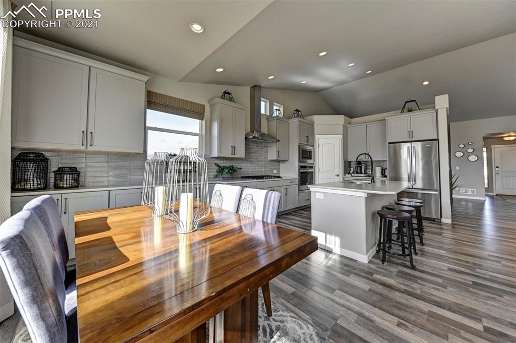 2903 Golden Meadow Way Colorado Springs, CO 80908 - Photo 19 of 49 a kitchen with a dining table chairs and view living room
