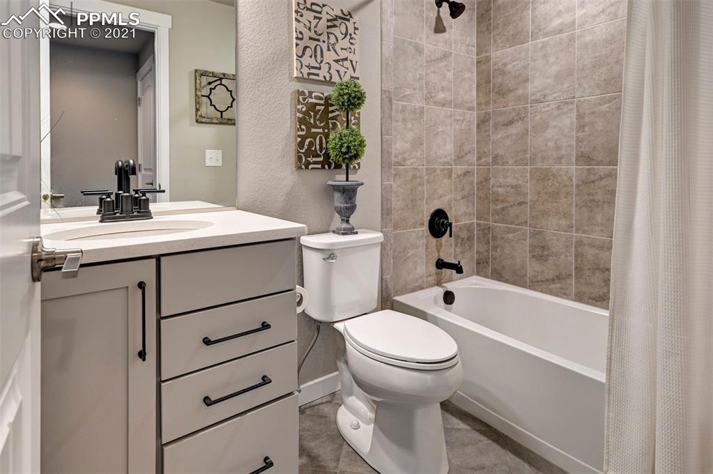 2903 Golden Meadow Way Colorado Springs, CO 80908 - Photo 40 of 49 a bathroom with a sink toilet and shower