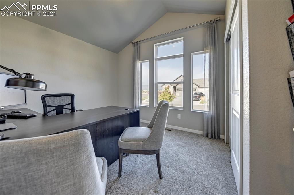 2903 Golden Meadow Way Colorado Springs, CO 80908 - Photo 44 of 49 a living room with furniture and a window