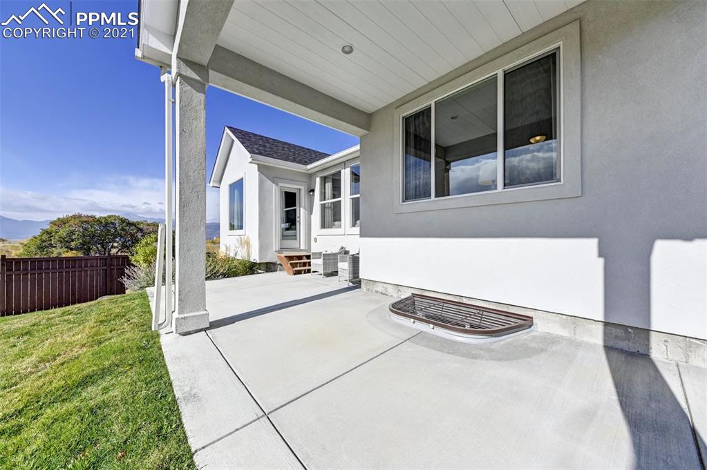 2903 Golden Meadow Way Colorado Springs, CO 80908 - Photo 48 of 49 a view of a house with backyard and porch
