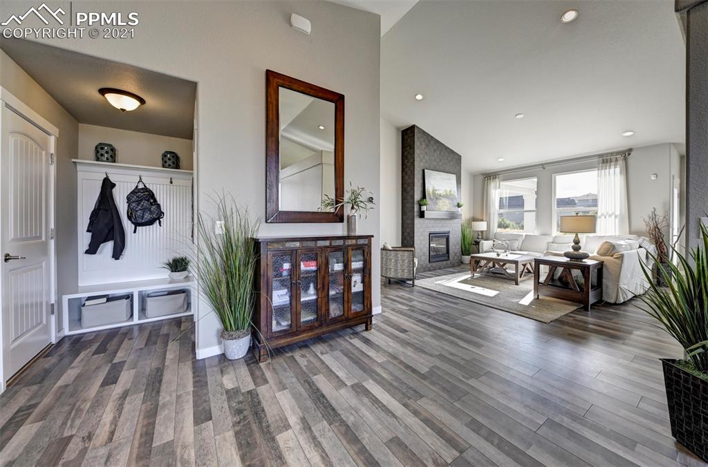 2903 Golden Meadow Way Colorado Springs, CO 80908 - Photo 7 of 49 a living room with furniture and wooden floor
