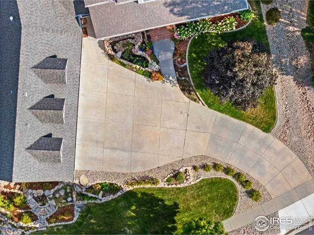 an aerial view of a house with a garden