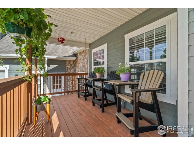a view of a patio with table and chairs and potted plants