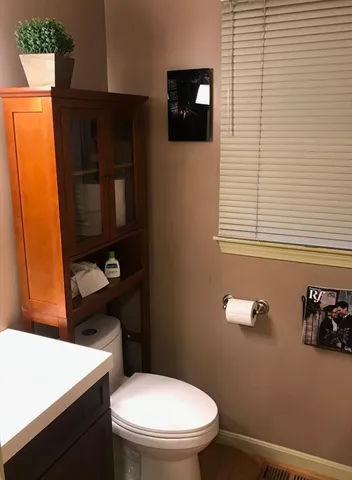a bathroom with a toilet and a sink