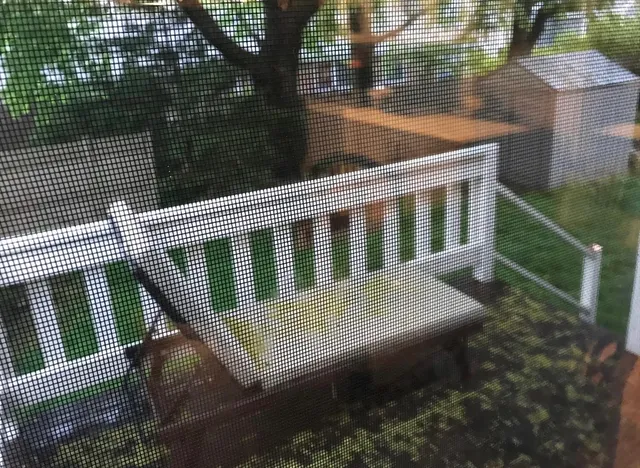 a view of balcony with wooden floor