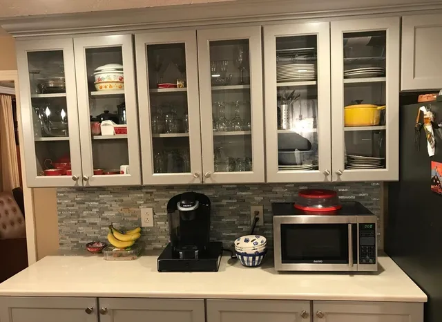 a kitchen with a stove and a microwave