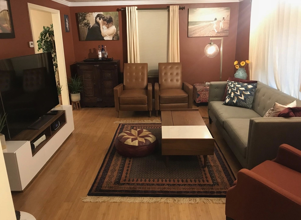 303 Lexington Street, Unit 303 Watertown, MA 02472 - Photo 5 of 13 a living room with furniture