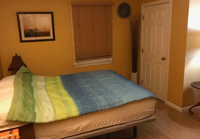 a view of a room with window and wooden floor